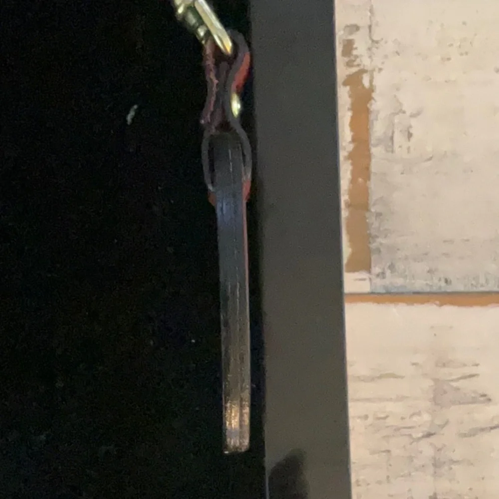 Cartier Elegant Red Leather Keychain with Gold Hardware